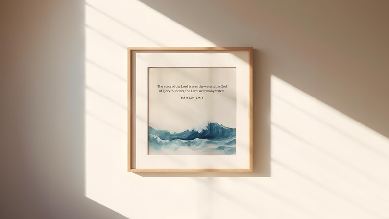 May include: A framed print with a watercolor painting of ocean waves. The print includes the text "The voice of the Lord is over the waters; the God of glory thunders, the Lord over many waters. Psalm 29:3"