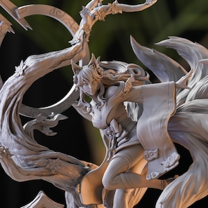 May include: A grey, detailed figurine of a woman with long hair and nine tails. She is wearing a flowing robe and has a fox-like face. The figurine is posed in a dynamic, action-oriented stance.