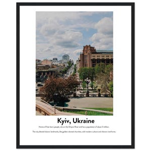 May include: Framed print featuring a scenic view of Kyiv, Ukraine, with a wide street lined with buildings and trees under a cloudy sky. The print includes the city's name and a brief description of its landmarks and population.