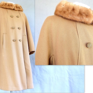 Vintage 1950's light brown, fur collared Holly Gab winter coat features a light brown mink fur collar & a double breasted front. There are 2 hooks on the removable collar that will snug the blonde fur, with a snap underneath. The front buttons. The 3/4 length sleeves are cut-on with a seam down the outside as well as the usual one underneath. There are 2 pockets in the front side seams with faux welts. It is lined with satin that has a backing of what looks like a loosely woven gray wool.