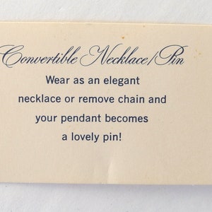 Note reads:  "Convertible Necklace Pin, wear as an elegant necklace or remove chain and your pendant becomes a lovely pin!"