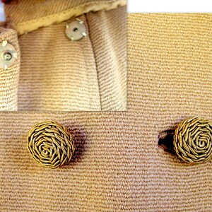 May include: Close-up of a beige women's coat with detailed wound soutache braid buttons. The buttons have a woven, rosette-like design. The coat fabric is a fine, textured weave.  The image shows the buttons and a section of the coat with covered snaps. The buttons are a key feature, showcasing their intricate craftsmanship.