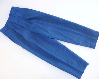 May include: A pair of blue pleated pants.