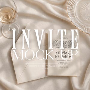 May include: A mock-up of a wedding invitation with an envelope, a glass of wine, and a decorative plate. The invitation features the text "INVITE MOCK UP" and details for "Olivia & Richards" with a date and address.