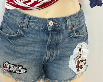 We The Free Distressed Denim Cutoff Shorts Looney Tunes Wile E Coyote 27