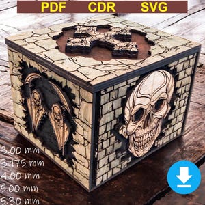 May include: A wooden box with a skull design on one side and a cross design on the top. The box is 7.62 cm, 8.06 cm, 10.16 cm, 12.7 cm, and 13.46 cm in size.