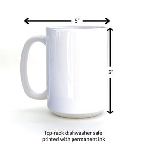 A white ceramic mug with measurements and a caption indicating that it is a "Top-rack dishwasher safe printed with permanent ink".