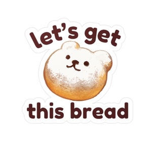 Op de afbeelding: Een sticker met een cartoonvormig gebakje in de vorm van een beer met witte glazuur. De bruine tekst luidt "let's get this bread". De sticker heeft een witte achtergrond.