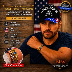 May include: A black baseball cap with the text SPACE FORCE and a triangular emblem on the front, featuring a USA flag pattern on the brim. A gold-toned link bracelet with square decorative tiles is worn on the wrist, shown in a circular inset.