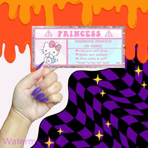 May include: A rectangular sticker with a pink glitter border and the text "PRINCESS" at the top. The sticker features a cartoon image of Hello Kitty and text that reads "PASSENGER PRINCESS ON BOARD". The sticker has a white background with pink text and a pink border.