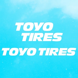 May include: White text on a light blue background reads "TOYO TIRES" twice, with the second instance slightly below the first. The background has a subtle cloudy effect, creating a clean and modern design.