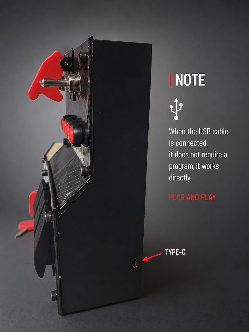 May include: A black rectangular control box featuring a red toggle switch, red push buttons, and a red ignition key. The side panel displays a USB Type-C port. Text on the side reads: NOTE, When the USB cable is connected, it does not require a program, it works directly. PLUG AND PLAY.