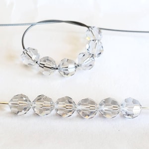 Dodici perle rotonde sfaccettate in cristallo ombra da 6 mm, articolo Swarovski n. 5000 fuori produzione, perle rotonde sfaccettate in cristallo ombra fuori produzione