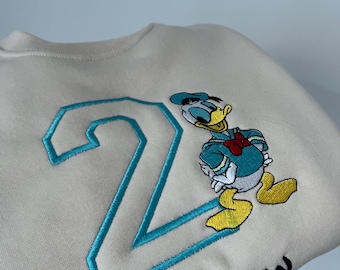 Gepersonaliseerde geborduurde Donald Duck | Disney-kindershirt