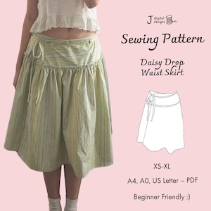 May include: A light green and white striped skirt with a drop waist design. The skirt is shown on a person and has a tie closure. The image also includes the text "Sewing Pattern" and "Daisy Drop Waist Skirt". The pattern is available in sizes XS-XL.
