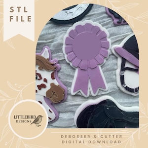 May include: A white ceramic mug with a black handle and the text "But First, Coffee" in a bold, black font. The mug is set against a blurred background, suggesting a cozy setting.