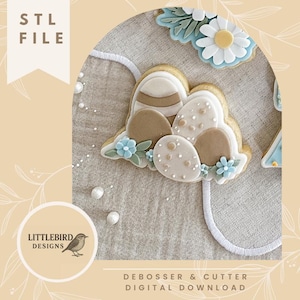 Könnte beinhalten: Ein Bild von Osterkeksen in Eiform, verziert mit braunem, beigem und weißem Zuckerguss und blauen floralen Akzenten. Das Bild enthält den Text "STL FILE" und "DEBOSSER & CUTTER DIGITAL DOWNLOAD".
