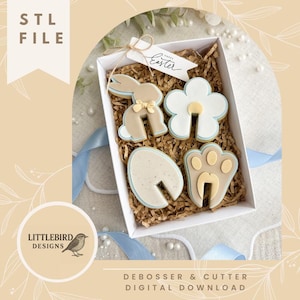 May include: A white box filled with Easter-themed cookies, including a bunny, flower, egg, and paw print. The cookies are decorated with light blue and tan icing. A tag reads "Happy Easter". The image also includes the text "STL FILE" and "DEBOSSER & CUTTER DIGITAL DOWNLOAD".
