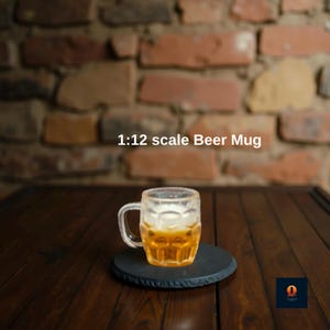 May include: A miniature beer mug, filled with a golden liquid, sits on a black coaster. The mug has a handle and is labeled "1:12 scale Beer Mug". The background features a brick wall and a dark wooden surface.