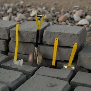 May include: A collection of miniature construction tools, including a shovel, pickaxe, hammer, and hatchet, with bright yellow handles and silver or black heads. The tools are arranged on gray concrete blocks, suggesting a construction or landscaping theme.