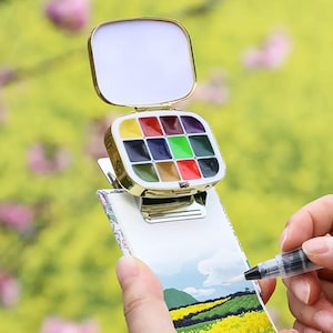 Mini juego de acuarela de viaje, tablero de dibujo con caja de pintura portátil de 12 colores, juego de pintura de acuarela sólida, regalos únicos para artistas, fiesta de arte