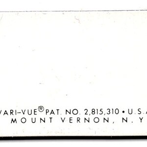 May include: White card with black text that reads "VARI-VUE&reg; PAT. NO. 2,815,310 &bull; U.S.A. MOUNT VERNON, N.Y."