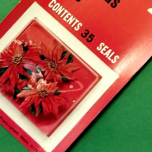 May include: A red and white package of 35 Christmas seals featuring a red poinsettia design. The package says "Contents 35 Seals" and "29&cent;".