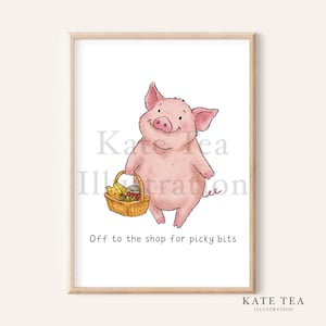 Könnte beinhalten: Gerahmter Druck eines fröhlichen rosa Schweins, das einen Korb mit Essen hält. Unter dem Schwein steht der Text "Off to the shop for picky bits". Der Name des Künstlers, "KATE TEA ILLUSTRATION", steht unten.