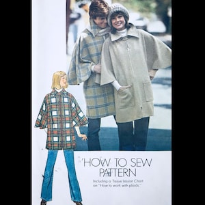 May include: A vintage sewing pattern for a cape coat with a zipper closure. The pattern includes instructions on how to work with plaid fabrics. The image shows two models wearing the cape coat in different plaid patterns.
