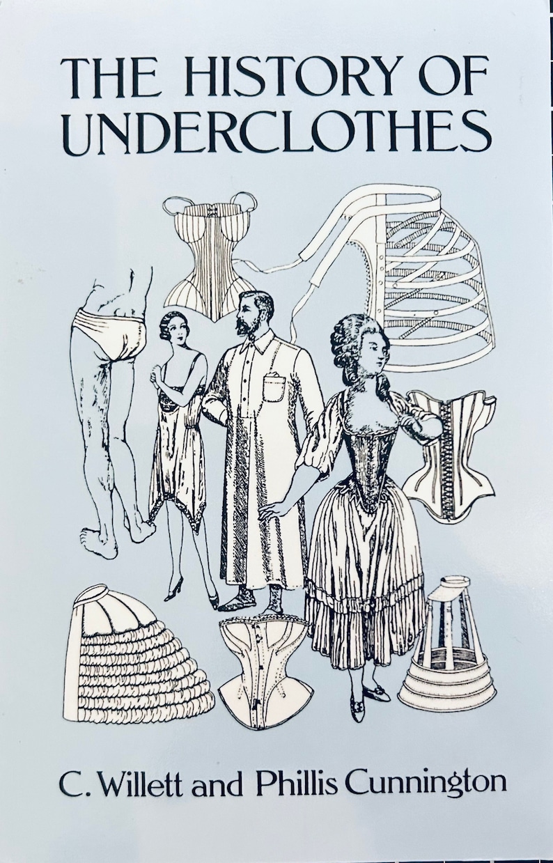 May include: A vintage illustration of undergarments from a book titled "The History of Underclothes" by C. Willett and Phillis Cunnington. The illustration features various styles of corsets, bustles, and other undergarments.