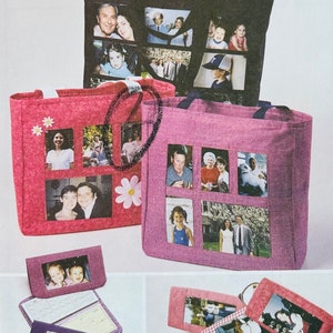 May include: Three pink and black tote bags with clear plastic windows displaying family photos. The bags have fabric handles and are made of a textured material.