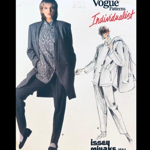May include: Vogue Patterns Individualist fashion sewing pattern featuring a woman in a gray overcoat, patterned shirt, and checkered pants. The illustration includes a sketch of a pinstripe suit. The pattern is by Issey Miyake.