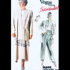 May include: A vintage Vogue Patterns sewing pattern featuring a woman in a beige suit with a long jacket and skirt. The pattern also includes a sketch of a similar outfit with pants. The text "Individualist" is visible.