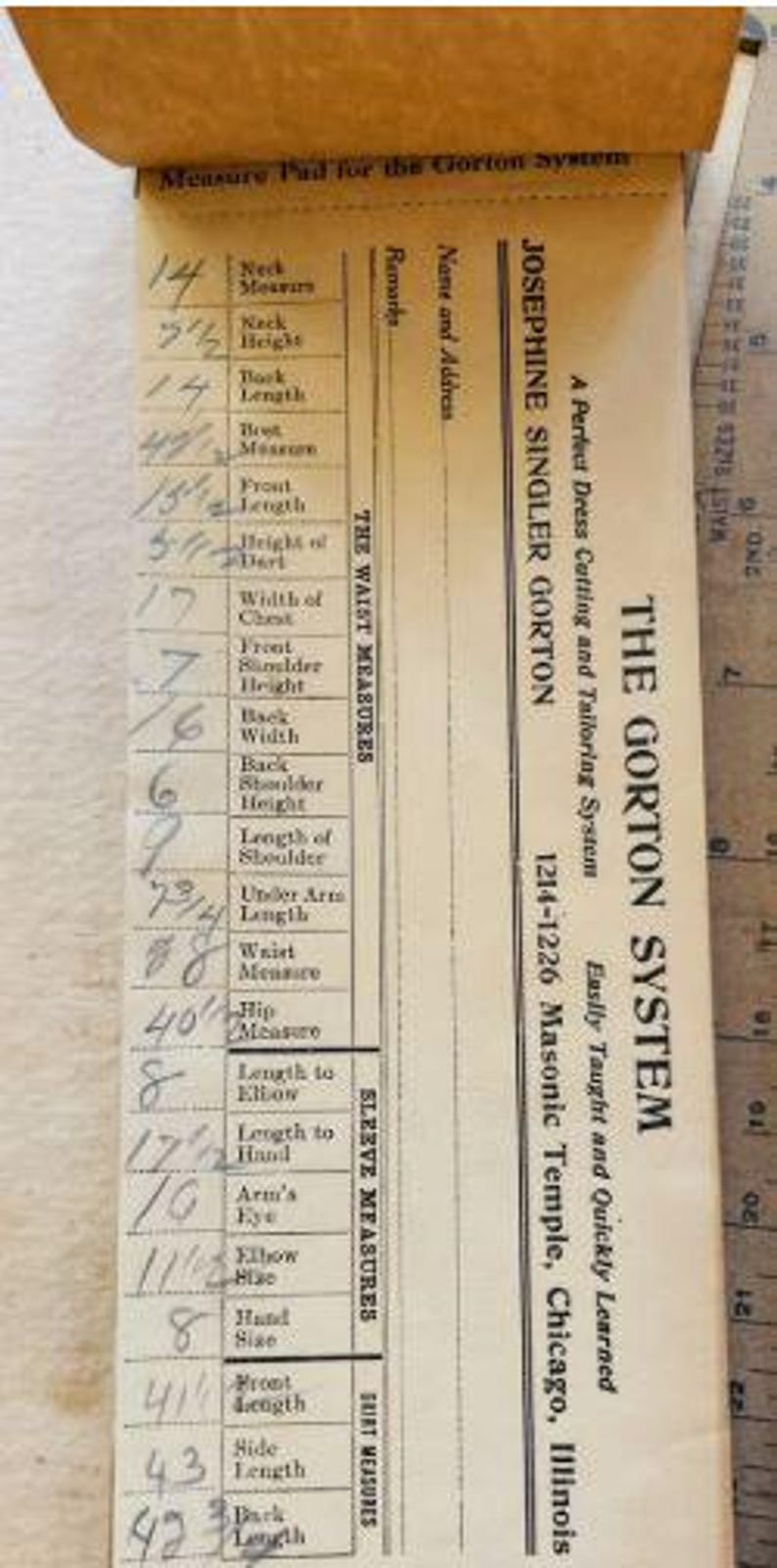 May include: A beige paper measure pad for the Gorton System, featuring printed categories for neck, waist, and sleeve measurements with handwritten numerical entries. The text includes Josephine Singler Gorton and Chicago, Illinois address details.