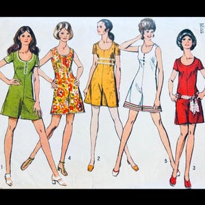 May include: Vintage sewing pattern featuring five different dress designs. The dresses are in various colors, including green, yellow, orange floral, white, and red. Each dress has a unique style, with details like buttons, belts, and different sleeve lengths.