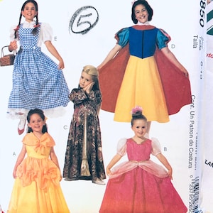 May include: A sewing pattern envelope labeled 2850 featuring illustrations of five different costumes: a blue and white gingham dress, a blue, yellow, and red dress with a cape, a long dark patterned gown, a yellow dress, and a pink dress with puff sleeves.