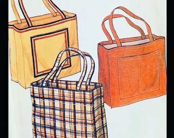 May include: Three tote bags in a watercolor style. One is tan with a dark border, another is orange with a pocket, and the third is a plaid pattern in shades of brown, blue, and yellow. All have matching handles.