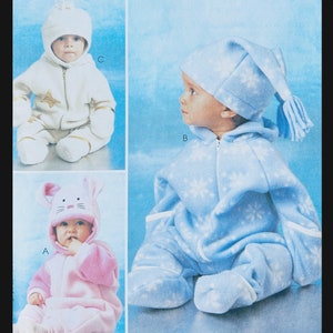 May include: Three baby onesies with attached hoods. The onesie on the left is pink with a rabbit head hood. The onesie in the middle is blue with a snowflake pattern and a pointed hood with a tassel. The onesie on the right is white with a star pattern and a white hood.