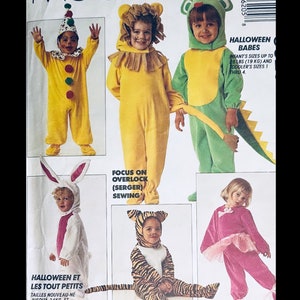 May include: A pattern for children's Halloween costumes, featuring a clown, lion, frog, bunny, tiger, and ballerina. The costumes are shown in various colors, including yellow, green, pink, and orange. The pattern includes sizes for infants and toddlers.