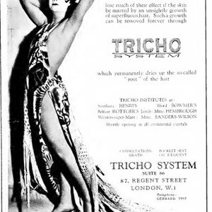May include: A black and white advertisement for a hair removal service called "Tricho System". The ad features a woman in a flowing dress, with the text "Modern Dress and Sheer Silken Hose lose much of their effect if the skin be marred by an unsightly growth of superfluous hair. Such a growth can be removed forever through Tricho System which permanently dries up the so-called "root" of the hair." The ad also includes information about Tricho Institutes located in various cities, including London, England.