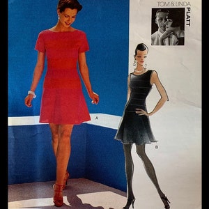 May include: Two women's dress patterns, one in red and one in black, with a photo of a couple in the top right corner. The text "TOM & LINDA PLATT" is printed on the page.