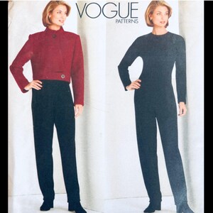 May include: Vogue Patterns sewing pattern featuring a two-piece outfit and a jumpsuit. The two-piece outfit includes a burgundy cropped jacket with a single button closure and black pants. The jumpsuit is black with long sleeves. The Vogue Patterns logo is visible.