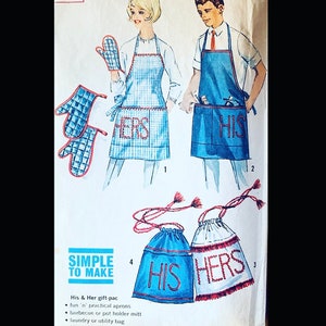 May include: A sewing pattern for two aprons with the words "His" and "Hers" printed on them. The aprons are blue and white gingham with red trim. The pattern also includes instructions for making pot holders.