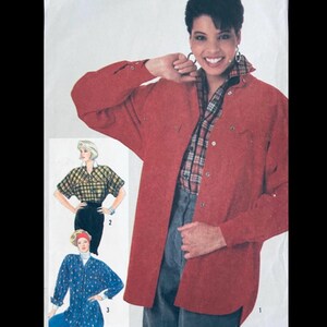 May include: A sewing pattern envelope featuring a long-sleeved red button-down shirt worn over a plaid shirt and grey trousers. The illustration also displays two additional shirt variations: a short-sleeved plaid top and a blue patterned shirt.