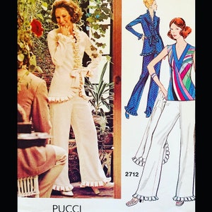 May include: A vintage sewing pattern featuring two women's outfits. The first outfit is a white pantsuit with ruffled trim. The second outfit is a white pants with a colorful striped top. The pattern number is 2712.