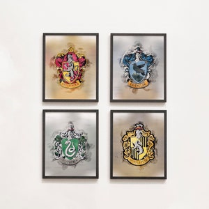 May include: Four framed prints of the Hogwarts house crests. Each crest is surrounded by a watercolor-style background. The crests are Gryffindor, Ravenclaw, Slytherin, and Hufflepuff.