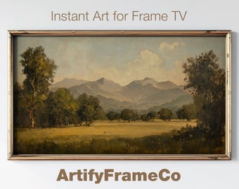 May include: A framed landscape painting depicting a mountain range with a valley in the foreground. The painting is in a brown wooden frame and has a vintage aesthetic.