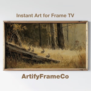 May include: A framed print of a forest scene with rabbits near a fallen log. The artwork has a vintage aesthetic with warm, earthy tones. Text at the top reads "Instant Art for Frame TV" and at the bottom "ArtifyFrameCo".