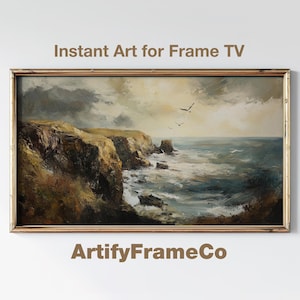 May include: A framed landscape painting of a coastal scene. The artwork depicts cliffs, ocean waves, and birds under a cloudy sky. The text "Instant Art for Frame TV" and "ArtifyFrameCo" are visible.