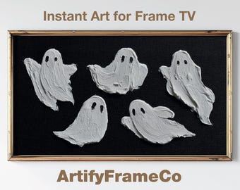 May include: A digital artwork display for a television featuring five white, textured ghost figures with black eyes against a solid black background, enclosed in a thin metallic frame. The text reads Instant Art for Frame TV and ArtifyFrameCo.